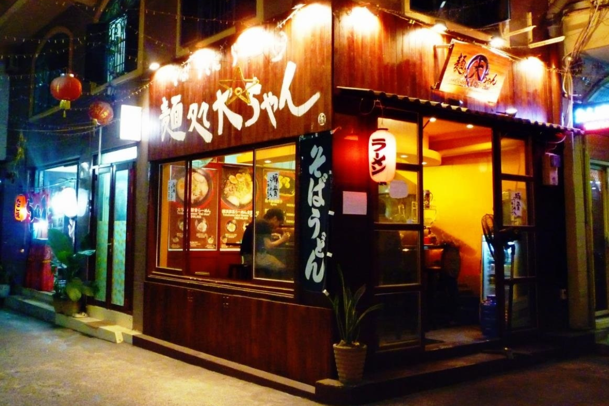 Lantern-lit alley in Japan Town, Saigon, with Japanese-style cafes and restaurants