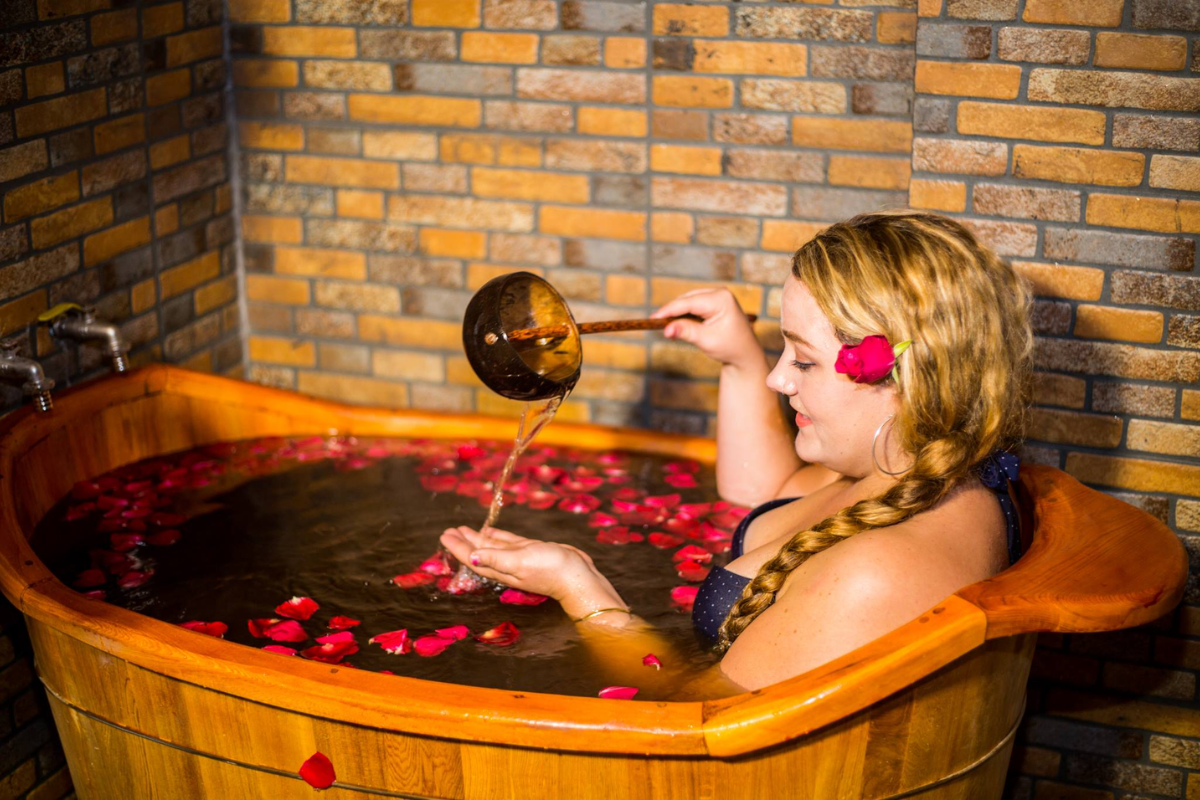 Wooden herbal bath tub used by Red Dao people for traditional healing in Sapa