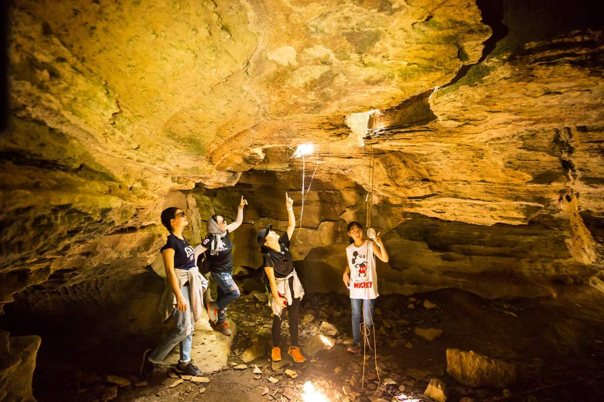 Inside Son Moc Huong Cave with glowing stalactites in Moc Chau