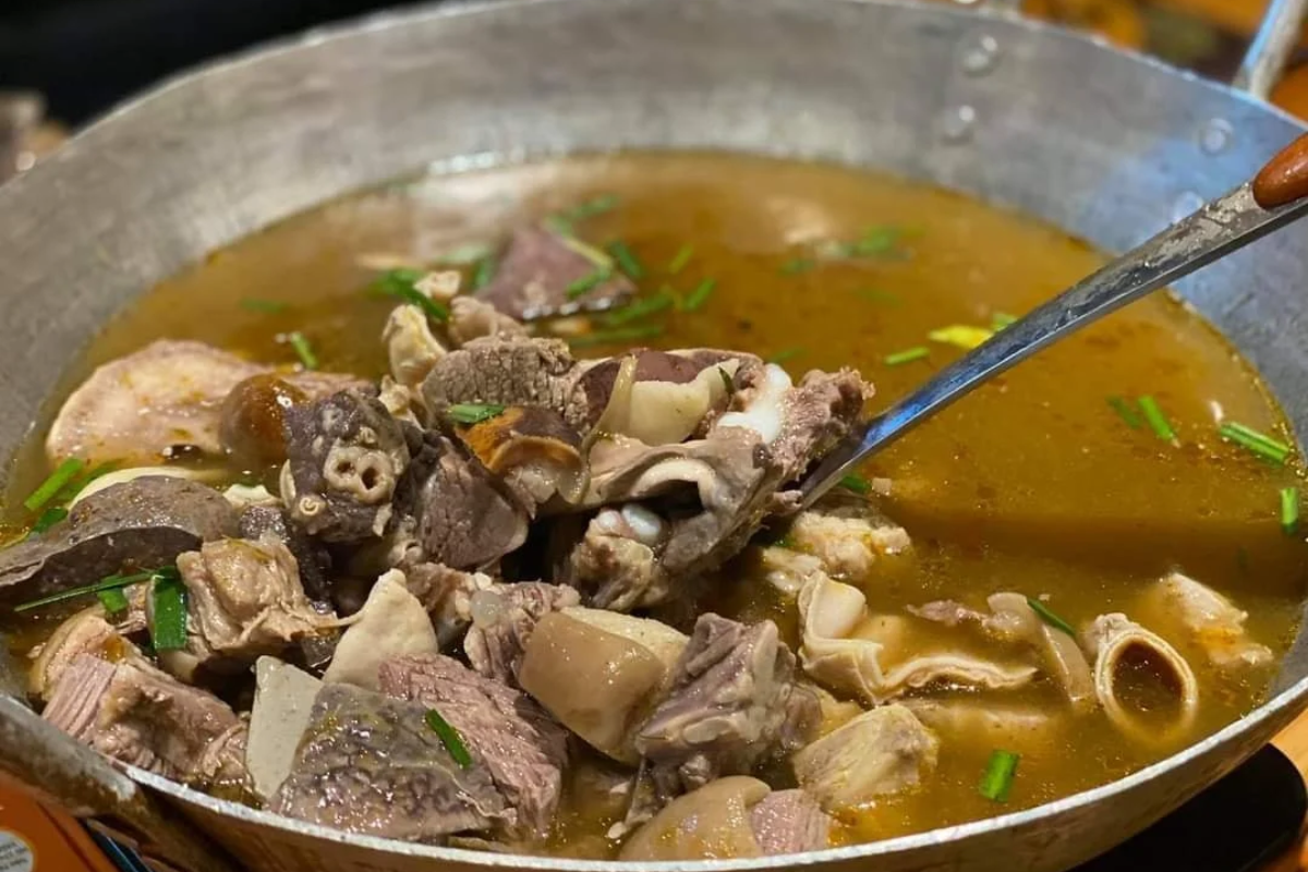 Traditional Thang Co soup made from horse meat and herbs at a market in Sapa