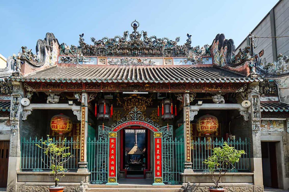 Intricate wooden carvings and ancient architecture at Thien Hau Pagoda, a famous Chinese assembly hall in Saigon