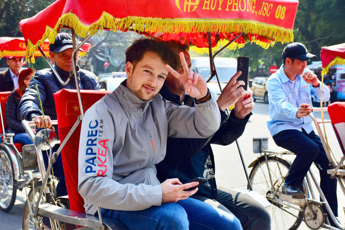 Tourists riding cyclo through Hanoi Old Quarter in December